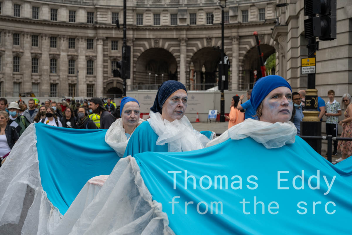 Extinction Rebellion Impossible Rebellion protest — XR Samba members dressed as the ocean, London